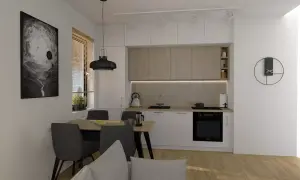 Nowoczesna kuchnia z jadalnią, czarne dodatki, obraz na ścianie.